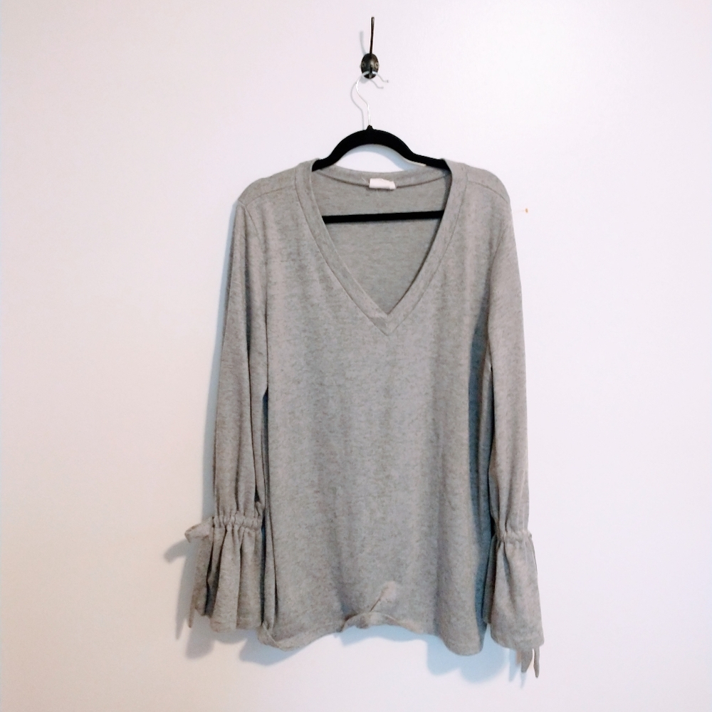 Simple Suzanne Betro grey v neck long sleeve top with bows on the sleeves size 1
